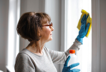 woman cleaning the window